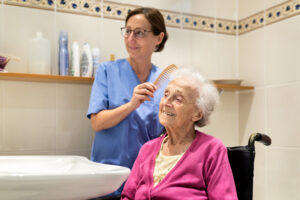 hospice chha helping to brush hospice patient's hair