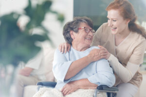 hospice nurse smiling with hospice patient