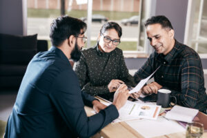 Business meeting with couple around the table