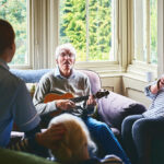 Hospice patient playing guitar Hospice patient playing guitar
