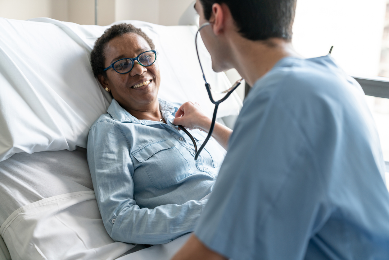 Smiling patient in hospital bed