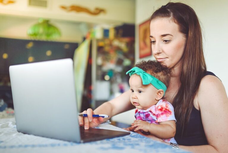 Young girl and infant video chatting