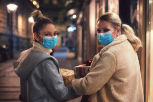 Sisters shopping in masks