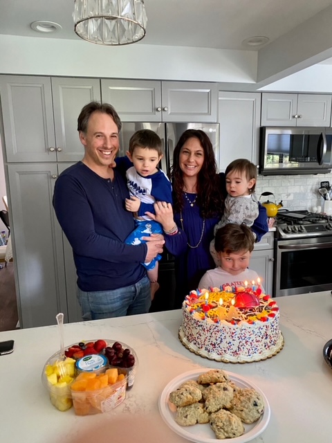 The Snyder Family in Their Kitchen Smiling