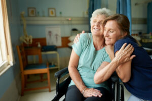 happy senior woman with her daughter at hospital