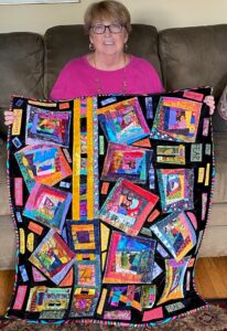 Suzanne Egan Hill with Quilt