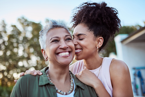 Smile, mother and child in a garden for love, peace and care together on mothers day. Happy, relax and calm woman with affection for her senior mom at a home for people in retirement in a backyard
