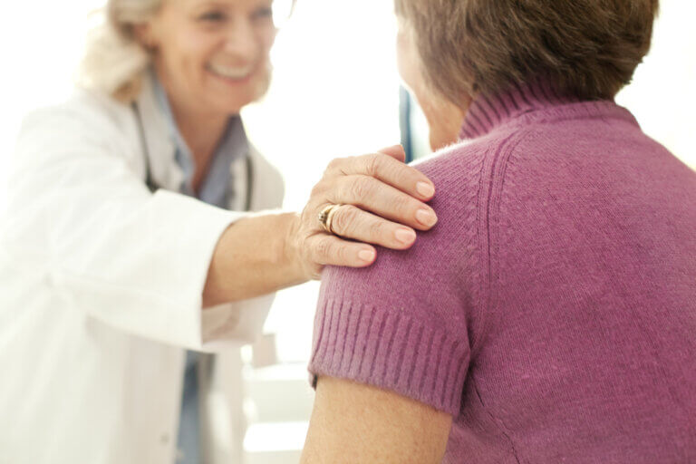 Doctor comforting a patient