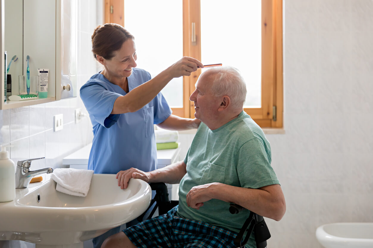 Home Health Aide supporting patient with daily cleaning