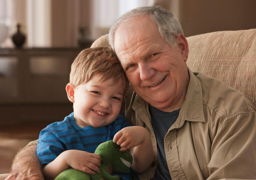 Grandfather and grandson hugging