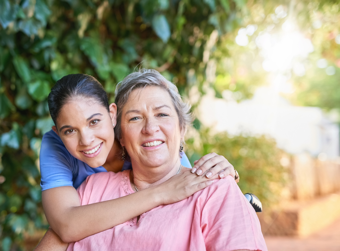 caregiver giving patient a hug