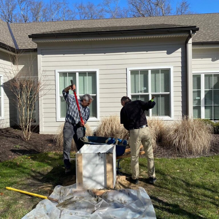 Jim Dubroff and Jim Ramsey installing pedestals for sculptures.