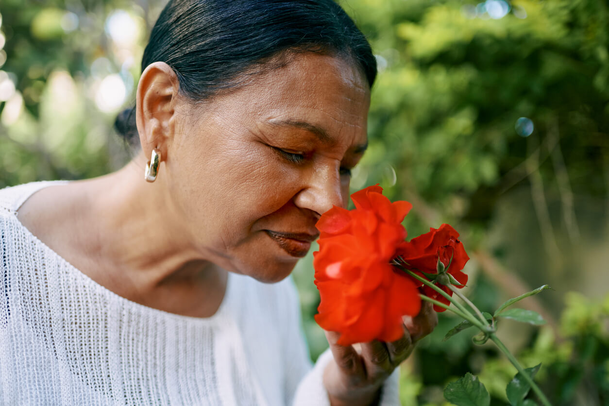 woman smelling flowers