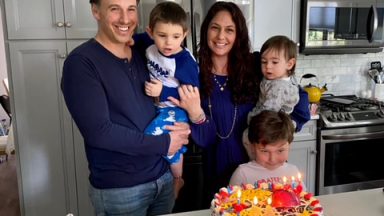 The Snyder Family in Their Kitchen Smiling