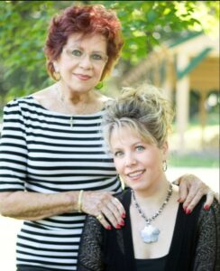 Charolotte standing behind her daughter Tara.