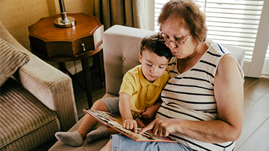 Grandmother and grandson reading