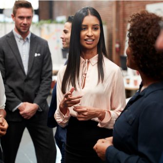 business team standing during informal meeting in modern office