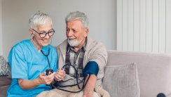 Patient having blood pressure measured by a medical worker