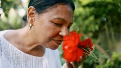 woman smelling flowers