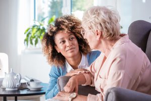 home care worker talking with patient