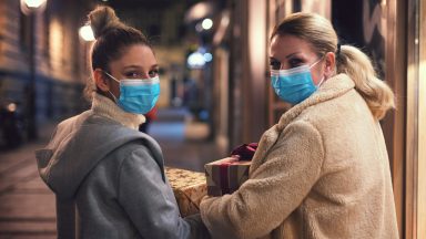 Sisters shopping in masks