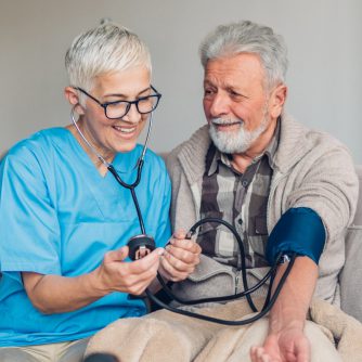 mature man having blood pressure taken