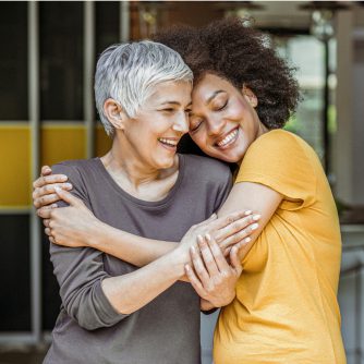 two woman embracing